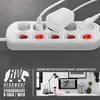 A close-up of a white power strip with multiple outlets and individual switches, followed by a lifestyle shot of a desk setup with a computer and accessories. Anteprima dell’immagine prodotto