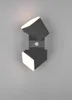 A modern, dark gray LED wall light with two cube-shaped fixtures, each emitting warm white light. A small, circular motion sensor is visible in the center. Anteprima dell’immagine prodotto