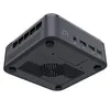 A dark gray mini PC is shown from a low angle, highlighting its ports and ventilation. Produktbild-Vorschau
