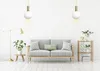 A minimalist living room scene with a sofa, floor lamp, and a shelving unit. Voir les images du produit