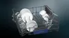 A dishwasher rack filled with clean dishes, glasses, and bowls. Produktbild-Vorschau