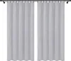 Two white curtains hanging on a black curtain rod against a white background. Podgląd zdjęcia produktu
