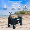 A beach scene with a wagon filled with items. Produktbild-Vorschau