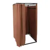 A freestanding changing room with brown curtains and a black metal frame, shown against a white background. Voir les images du produit