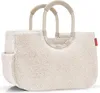 A fluffy cream-colored tote bag with beige handles, shown against a white background. Náhľad obrázku produktu