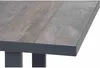 A close-up view of the corner of a table, showing the texture of the tabletop and the dark frame. Produktbild-Vorschau