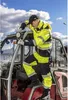 A person in workwear is working on a vehicle. Náhled obrázku produktu