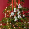 Christmas tree with ornaments hanging on red ribbons. Produktbild-Vorschau