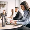 People in a meeting room setting, with a water bottle on the table. Náhľad obrázku produktu