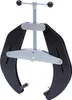 A black pipe alignment clamp with silver adjustment mechanisms is shown against a white background. Náhled obrázku produktu