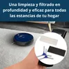A hand holding a remote control with a circular inset showing accessories for a robot vacuum cleaner, with the robot vacuum cleaner visible on a carpet in the background. Produktbild-Vorschau