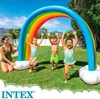 Children playing in a backyard with an inflatable rainbow sprinkler. Produktbild-Vorschau