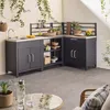 An outdoor kitchen setup with dark gray cabinets and a stainless steel countertop, featuring shelves with various kitchen items and plants. Anteprima dell’immagine prodotto