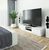 A modern living room with a TV, speakers, and a plant. Anteprima dell’immagine prodotto