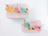 Two ice chests filled with crushed ice, each containing colorful spherical frozen drinks with straws and garnishes. Podgląd zdjęcia produktu