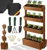 A multi-tiered wooden planter with various plants and gardening tools. Produktbild-Vorschau