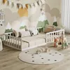 A child's bedroom with a bed, toys, and wall decorations.