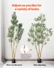 Two artificial olive trees are shown side-by-side, demonstrating how to adjust them for a better look. Voir les images du produit