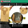 A person is holding a vacuum cleaner dust bag, with a vacuum cleaner drum shown in the background. Produktbild-Vorschau