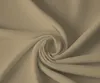 A close-up, swirled view of a sand-colored fabric, likely a fitted sheet. Produktbild-Vorschau