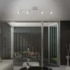 A modern living room with a view of an outdoor patio area. Produktbild-Vorschau