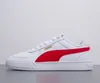 A side view of a white Puma sneaker with a red stripe and gold Puma logo. Produktbild-Vorschau