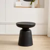 A black side table is shown in a room with white walls and light wood flooring. Produktbild-Vorschau
