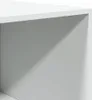 A close-up view of the corner of a white wardrobe, showing the interior and exterior surfaces with a shadow cast across it. Produktbild-Vorschau
