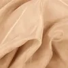 A close-up, draped view of a sheer, beige fabric. Voir les images du produit