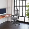 An office chair is placed next to a desk with a computer in a room with large windows. Podgląd zdjęcia produktu