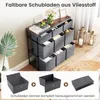 A storage unit with multiple fabric drawers, displayed in a room setting with decorative items. Anteprima dell’immagine prodotto