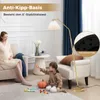 A pregnant woman and a child are in a living room with a floor lamp. Podgląd zdjęcia produktu