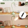 A split image showing a desk lamp in two states: off and on, with decorative items in the background. Produktbild-Vorschau
