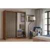 A bedroom scene featuring a wardrobe, armchair, and bed. Produktbild-Vorschau