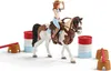 A toy horse and rider set with barrels and jump obstacles. Anteprima dell’immagine prodotto