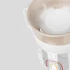 A close-up of a baby's sippy cup with a rainbow design. Produktbild-Vorschau