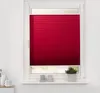 A red pleated blind is shown in a window frame, with a small potted plant and decorative objects on the windowsill below. Produktbild-Vorschau