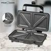 A sandwich toaster is open and displayed on a marble countertop. Podgląd zdjęcia produktu