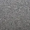 A close-up view of dark gray gravel or sand with small reflective particles. Produktbild-Vorschau