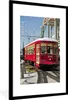 MuchoWow® Gerahmtes Poster Eine rote Straßenbahn befördert Produktbild-Vorschau 1