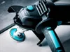 Close-up of an angle grinder with a diamond cutting disc attached, resting on a surface. Anteprima dell’immagine prodotto