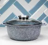 A speckled gray pot with a glass lid sits on a white surface in front of a herringbone tile backsplash. Voir les images du produit