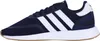 A side view of a navy blue Adidas sneaker with white stripes. Anteprima dell’immagine prodotto