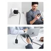 Collage showing a Ugreen charger plugged into a wall and a person using a phone, and another scene of a charger connected to a phone on a desk with a laptop. Anteprima dell’immagine prodotto