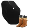 A stack of black boot shapers and a pair of brown boots. Podgląd zdjęcia produktu