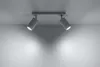 A ceiling light fixture with two adjustable spotlights mounted on a rectangular base, illuminating a plain wall. Náhled obrázku produktu