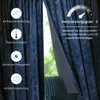 A close-up view of dark blue velvet curtains with a floral pattern, showcasing various features and benefits. Produktbild-Vorschau
