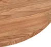 Close-up of the edge of a round wooden table top. Náhled obrázku produktu