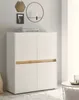 A modern white and wood tone cabinet is shown in a room with decorative items on the wall and a small table to the side. Produktbild-Vorschau