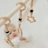 leg&go Portique d’éveil bébé en bois - Arche d’éveil Voir les images du produit 2